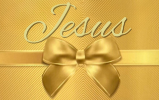 Jesus' name on a gold wrapped gift with a gold bow