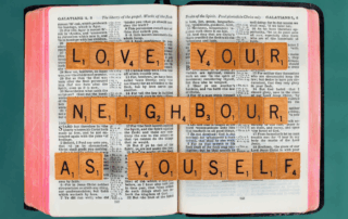 scrabble letters spelling Bible verse Galatians 5:14 love your neighbor as yourself