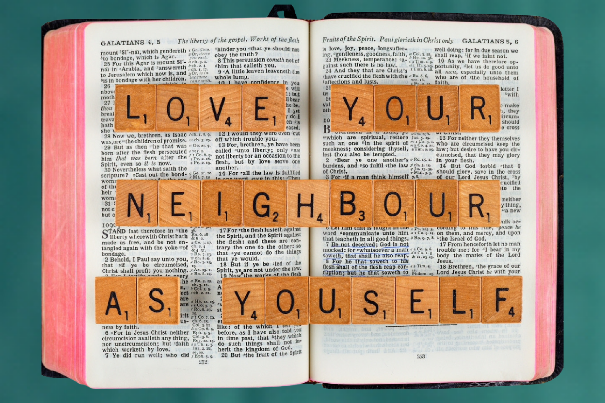 scrabble letters spelling Bible verse Galatians 5:14 love your neighbor as yourself