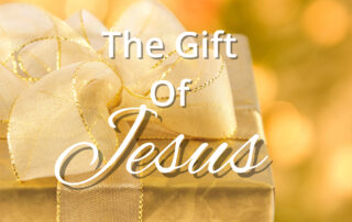 gold Christmas gift box with text The Gift of Jesus